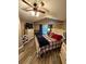 Main bedroom with wood-look floors and a ceiling fan at 5579 Se 44Th Cir, Ocala, FL 34480