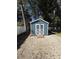 Blue storage shed with white trim and gravel base at 5579 Se 44Th Cir, Ocala, FL 34480