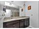 Elegant bathroom with double sinks, granite counters, and modern lighting at 6158 Sw 88Th Loop, Ocala, FL 34476