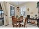 Bright kitchen nook with wood table and window seating at 6158 Sw 88Th Loop, Ocala, FL 34476