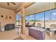 Relaxing screened porch with outdoor furniture and a view of the backyard at 6158 Sw 88Th Loop, Ocala, FL 34476