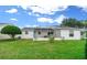 Screened patio and lush landscaping in the backyard at 7994 Se 174Th Belhaven Loop, The Villages, FL 32162