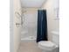 Bathroom featuring a walk-in shower with grab bars at 7994 Se 174Th Belhaven Loop, The Villages, FL 32162