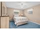 Cozy bedroom with light wood furniture and carpeted floors at 7994 Se 174Th Belhaven Loop, The Villages, FL 32162