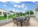 Relaxing screened porch with outdoor furniture at 7994 Se 174Th Belhaven Loop, The Villages, FL 32162