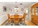 Bright dining room with wood table and chairs, and built-in hutch at 8420 Sw 93 Ln # E, Ocala, FL 34481