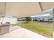 Covered patio with spacious concrete slab and hot tub at 8420 Sw 93 Ln # E, Ocala, FL 34481