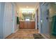 Bathroom with double vanity, neutral tones, and a large walk in shower at 8652 Se 133Rd Ln, Summerfield, FL 34491