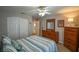 Bedroom with double bed, dresser and large closet at 8652 Se 133Rd Ln, Summerfield, FL 34491