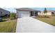 One-story house with a large driveway and front yard at 8761 Sw 79Th Loop, Ocala, FL 34481