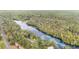 Aerial view showing home near river with lush green trees at 9050 Sw 190Th Cir, Dunnellon, FL 34432