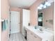 Simple bathroom with a single sink, vanity, and white tile at 9050 Sw 190Th Cir, Dunnellon, FL 34432