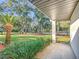 Front porch view showcasing the manicured lawn and neighborhood at 9050 Sw 190Th Cir, Dunnellon, FL 34432