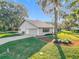 Attached garage with ample space and well-maintained landscaping at 9050 Sw 190Th Cir, Dunnellon, FL 34432