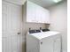 Laundry room with washer, dryer, and cabinets at 9050 Sw 190Th Cir, Dunnellon, FL 34432