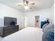 Large bedroom with king bed, dresser and en-suite bathroom at 9474 Sw 52Nd Loop, Ocala, FL 34481