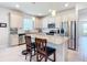 Modern kitchen with granite countertops, stainless steel appliances, and an island at 9474 Sw 52Nd Loop, Ocala, FL 34481