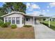 Cute and cozy ranch-style home with carport and nicely landscaped yard at 10161 Sw 88Th Ter, Ocala, FL 34481