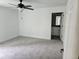 Spacious bedroom with carpet flooring and ceiling fan at 12137 Se 89Th Ter, Belleview, FL 34420