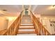 Wooden staircase leading to the upper level at 12195 Sw 39Th Ln, Ocala, FL 34481