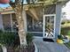 Exterior view of the home's screened porch and entrance at 13300 Se 97Th Terrace Rd, Summerfield, FL 34491