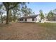 House with a large backyard and mature trees at 13740 Sw 49Th Pl, Ocala, FL 34481