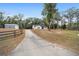 Ranch home with a long driveway and detached workshop at 13740 Sw 49Th Pl, Ocala, FL 34481