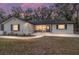 Updated single-story home with a welcoming front porch and landscaped yard at 13740 Sw 49Th Pl, Ocala, FL 34481