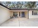 Inviting front porch with blue door and potted plants at 13740 Sw 49Th Pl, Ocala, FL 34481