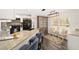Updated kitchen featuring granite countertops and a breakfast bar at 13740 Sw 49Th Pl, Ocala, FL 34481