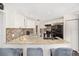 Modern kitchen with granite countertops and stainless steel appliances at 13740 Sw 49Th Pl, Ocala, FL 34481