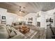 Spacious living area featuring a wood-burning fireplace and vaulted ceilings at 13740 Sw 49Th Pl, Ocala, FL 34481