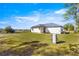 View of the backyard with a covered patio and well at 14764 Sw 34Th St, Ocala, FL 34481