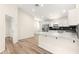 Modern kitchen with white cabinets and concrete countertop at 14764 Sw 34Th St, Ocala, FL 34481