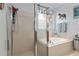 Bathroom with a shower and tub at 15092 Sw 14Th Avenue Rd, Ocala, FL 34473