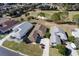 Three houses next to a golf course, seen from above at 15440 Sw 14Th Avenue Rd, Ocala, FL 34473