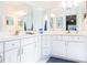 Double vanity bathroom with a large mirror and walk-in shower at 15440 Sw 14Th Avenue Rd, Ocala, FL 34473