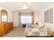 Spacious bedroom with a queen-size bed and decorative wall art at 15440 Sw 14Th Avenue Rd, Ocala, FL 34473