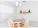 Cozy breakfast nook with a round table and white chairs at 15440 Sw 14Th Avenue Rd, Ocala, FL 34473