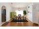 Charming dining room with a wood table, green cabinet, and hardwood floors at 15440 Sw 14Th Avenue Rd, Ocala, FL 34473