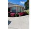 Side view of the house with beautiful pink flowers at 15440 Sw 14Th Avenue Rd, Ocala, FL 34473