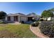 One-story home with red shutters, landscaping, and driveway at 15440 Sw 14Th Avenue Rd, Ocala, FL 34473