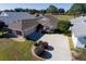 One-story home with attached garage, landscaped yard, and driveway at 15440 Sw 14Th Avenue Rd, Ocala, FL 34473
