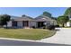 One story home with red shutters, landscaping and driveway at 15440 Sw 14Th Avenue Rd, Ocala, FL 34473