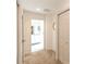 Hallway with carpet flooring, access to bathroom and closet at 15440 Sw 14Th Avenue Rd, Ocala, FL 34473