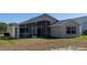 Back exterior view of house with screened porch at 15440 Sw 14Th Avenue Rd, Ocala, FL 34473