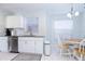 Updated kitchen with white cabinets, granite countertops, and breakfast nook at 15440 Sw 14Th Avenue Rd, Ocala, FL 34473