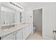 Double vanity bathroom with a toilet in a separate room at 15692 Sw 11Th Court Rd, Ocala, FL 34473