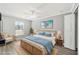 Relaxing bedroom with wicker bed frame and ocean-themed decor at 15692 Sw 11Th Court Rd, Ocala, FL 34473