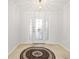 Bright foyer with tile flooring and a circular rug at 15692 Sw 11Th Court Rd, Ocala, FL 34473